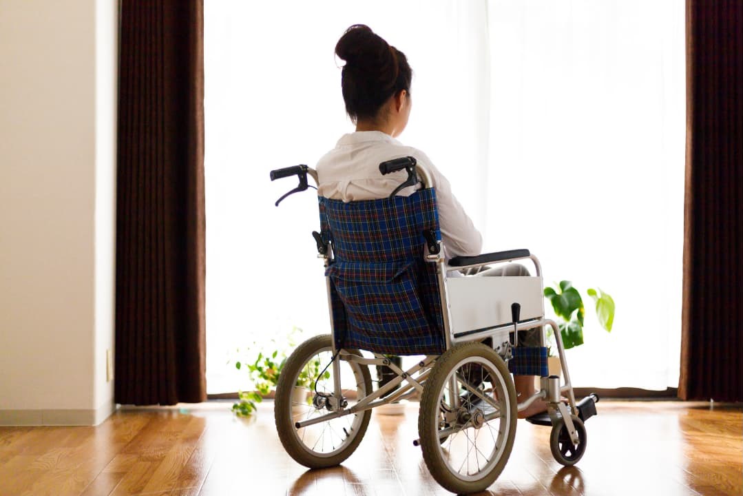 A woman on a wheelchair during a personal injury lawsuit