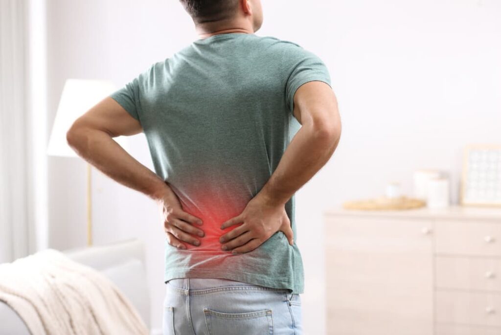 A person suffering back pain