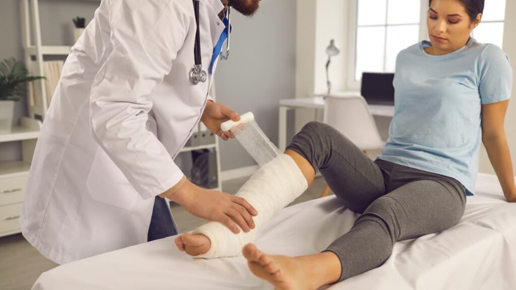 A physician treating fractures resulting from a slip-and-fall accident.