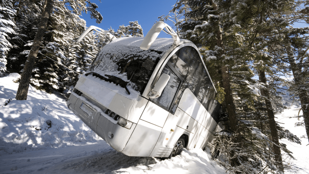 Snow-covered road with an overturned bus involved in an accident.