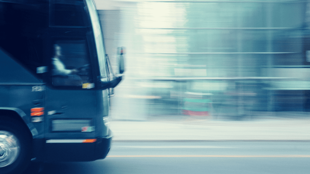 Overspeeding bus on the road, posing risk for accidents.