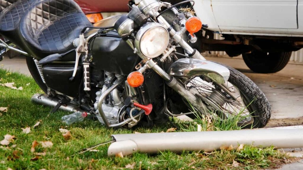 A motorcycle lying on the side of the road illustrating how even a single-vehicle accident can result in significant vehicle damage and potential injury.