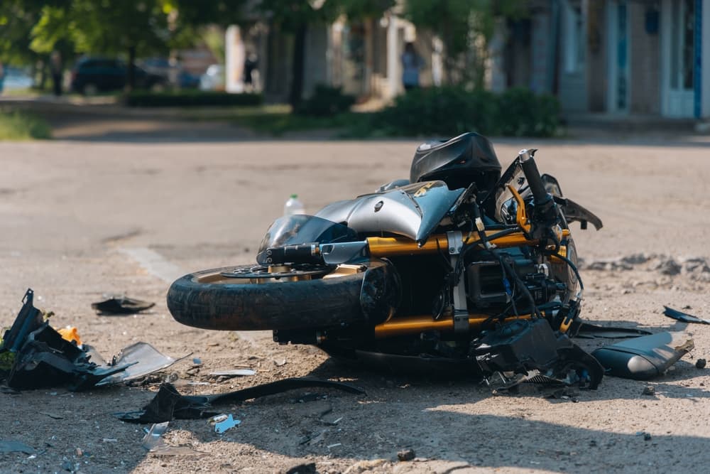 The motorcycle lies on the road after the collision