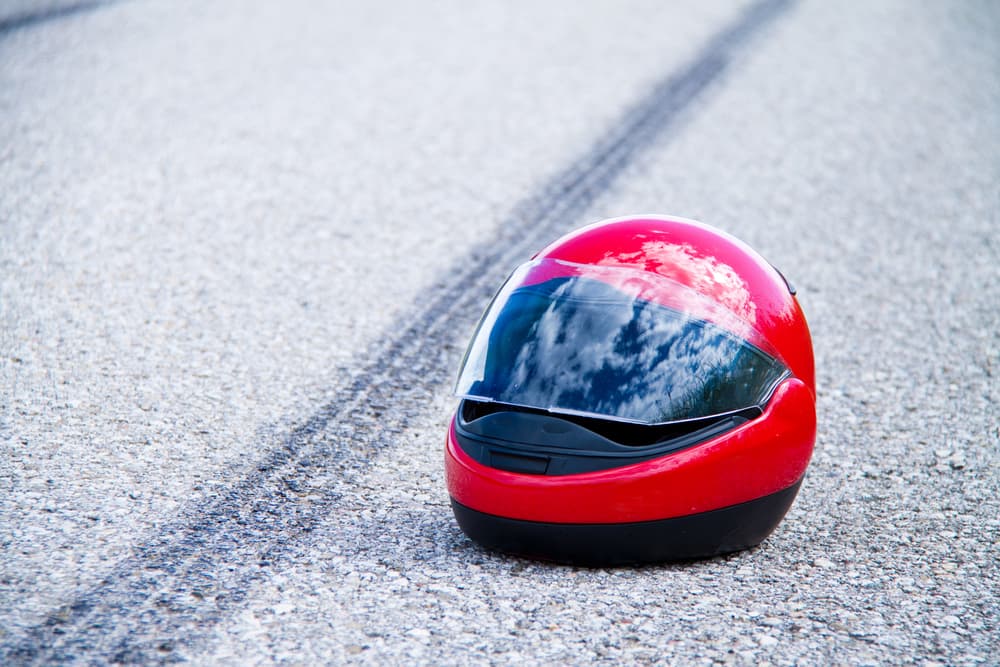 an accident with a motorcycle. traffic accident and skid marks on road