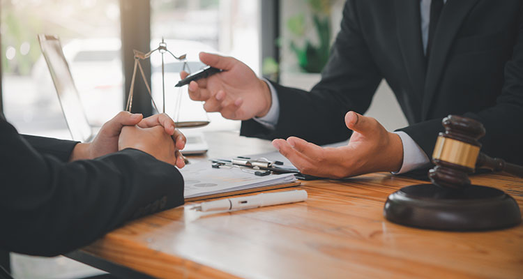 Attorneys advising a client about a pedestrian accident claim in Gary, Indiana