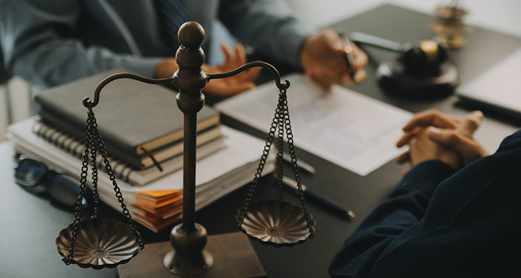 Attorney reviewing documents with a client after a South Bend bicycle accident
