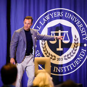 brandon yosha speaking at trial lawyers university summit